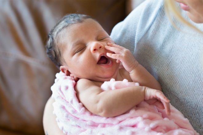 newborn baby yawning