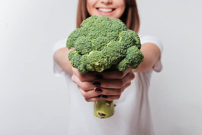 fertility boosting foods lady holding broccoli