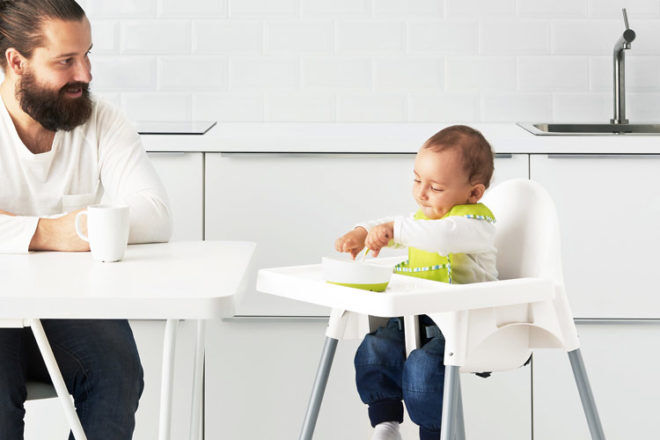 IKEA ANTILOP Baby Chair showing the height of the chair compared to the kitchen table and how comfortable a toddler is able to sit and eat. 