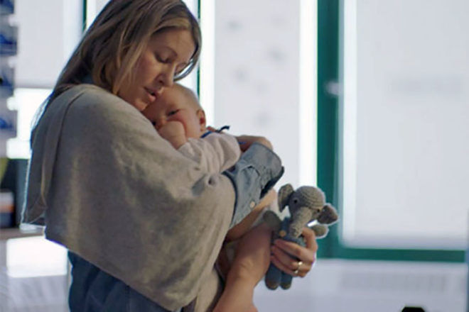 mum cradles sick baby in advertisement for SickKids Foundation