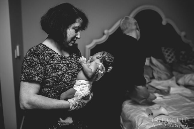 midwife delivers baby Tree of Life Doula Photography
