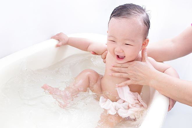 Baby in enjoying a warm bath