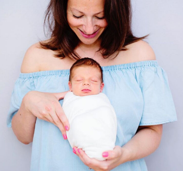 Alexa Drew Photography new mum with bundled up newborn