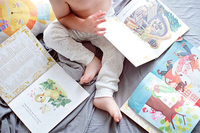 Keep your toddler entertained with books while feeding your newborn