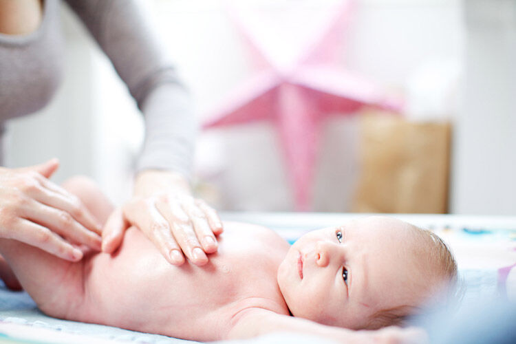 Baby massage on a change table