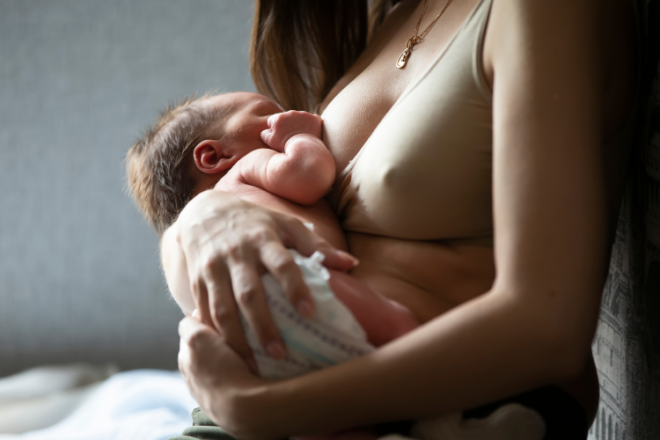 A baby feeding in the cradle position with skin to skin contact