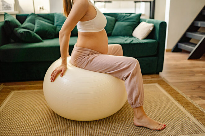 Pregnant Sitting exercise ball