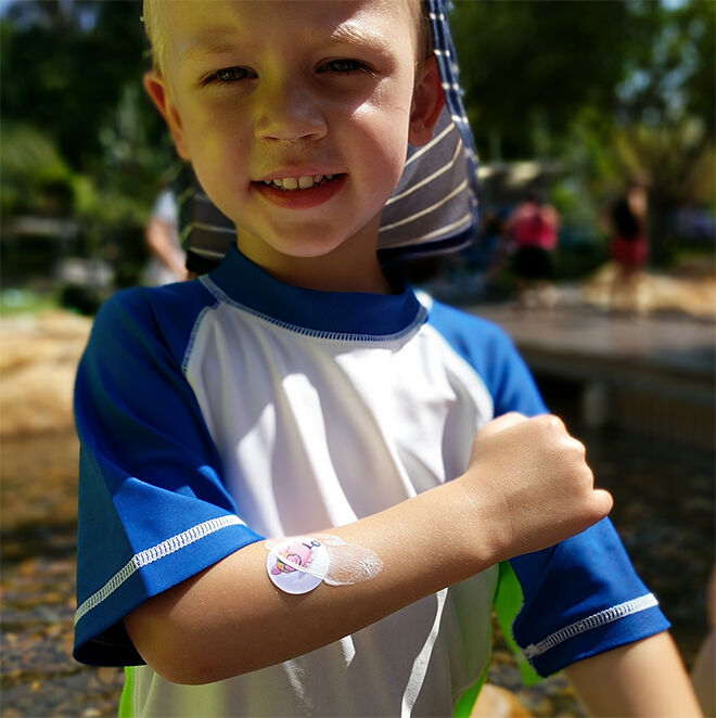 child wearing a Suncayr sunscreen spot