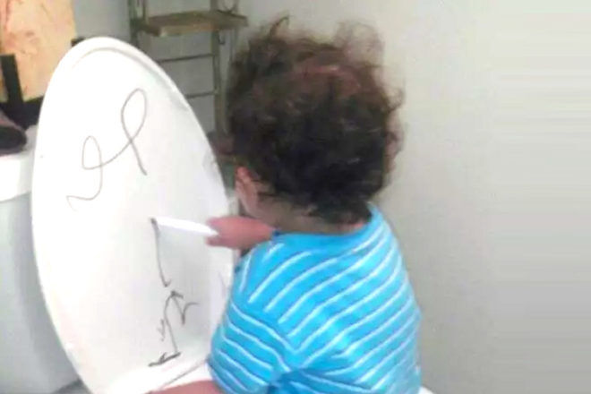toilet training tip - draw on back of toilet seat