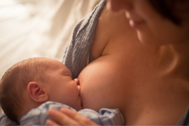 Mother breastfeeding a newborn baby with the correct latch