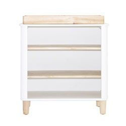 Open-shelf change table stocked with nappies and supplies