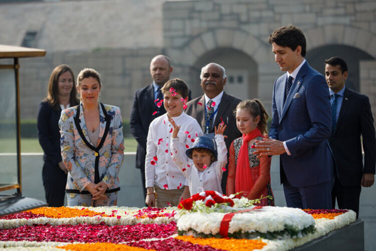Hadrien Trudeau throwing petals on trip to India