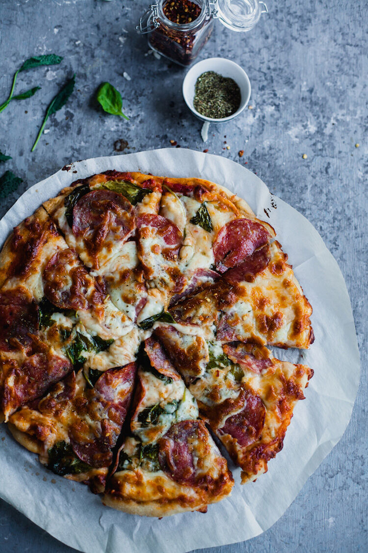 Spinach and sausage pizza