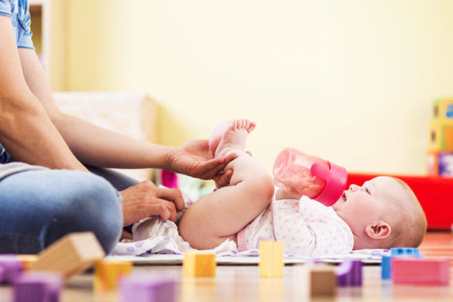 Avoid changing a baby on the floor as it may make them more likely to wriggle around