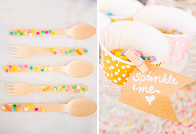 Baby shower table confetti and wooden cutlery