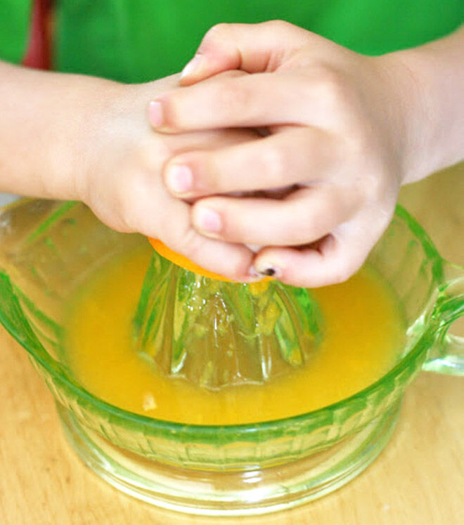 Kids squeeze orange juice