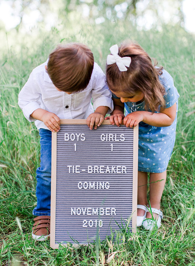 Brother and sister pregnancy announcement with letter board