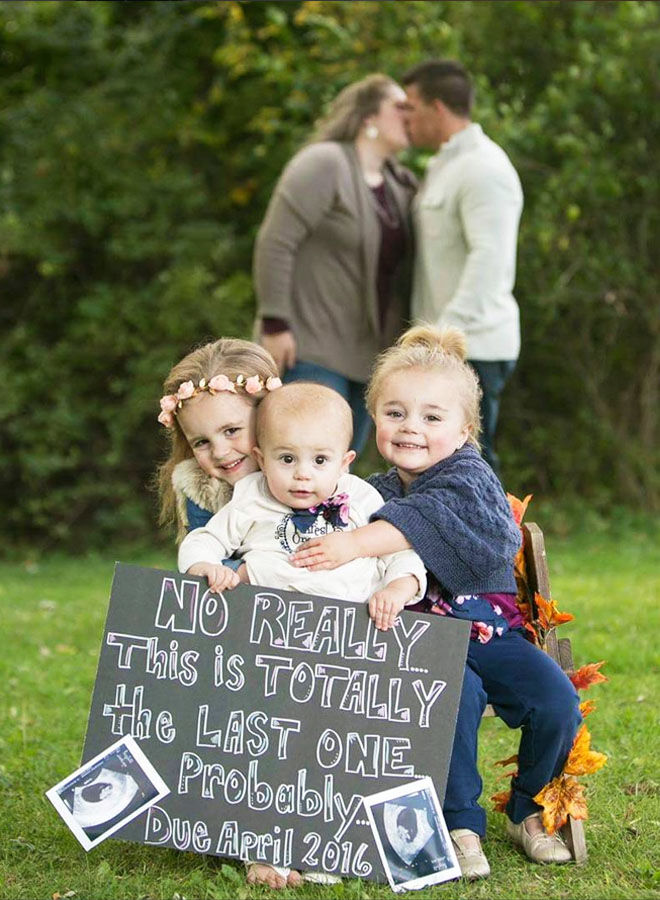 Sibling pregnancy announcement with chalkboard