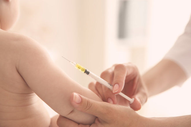 Meningococcal vaccination: baby being immunised