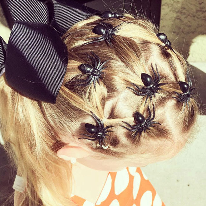 Halloween hairstyle with spiders and a bow