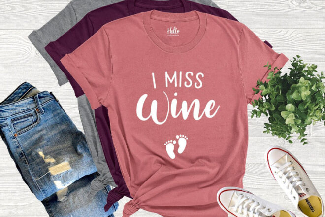 A pink tshirt with the words 'I miss wine' written on the front