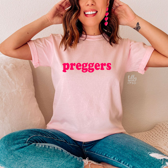 A pink tshirt with the words 'preggers' written on the front