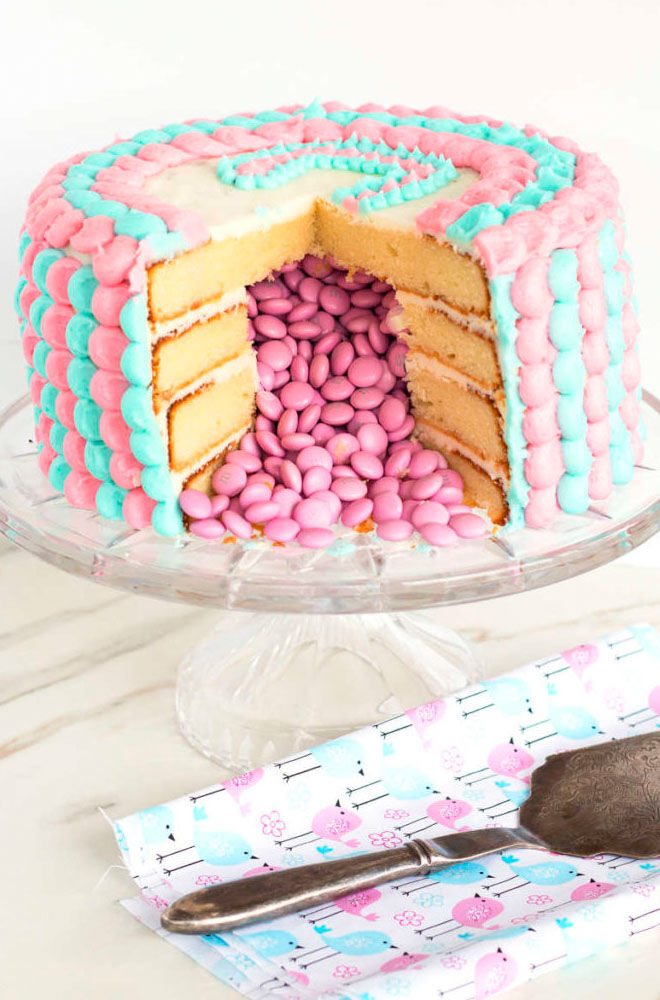 Pink gender reveal piñata cake