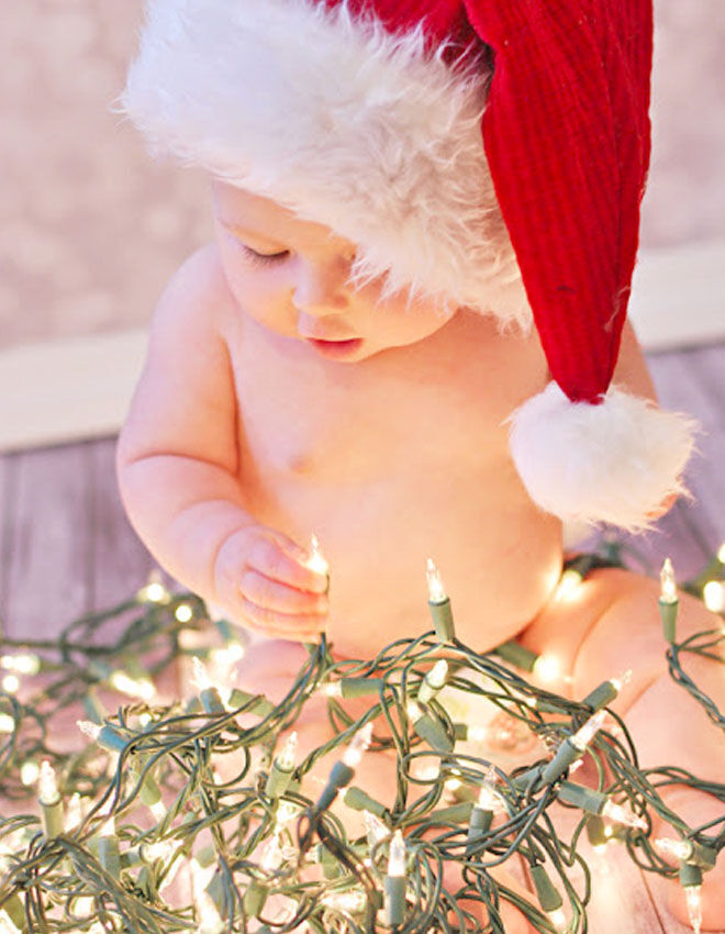 Baby's first Christmas photo with Christmas lights