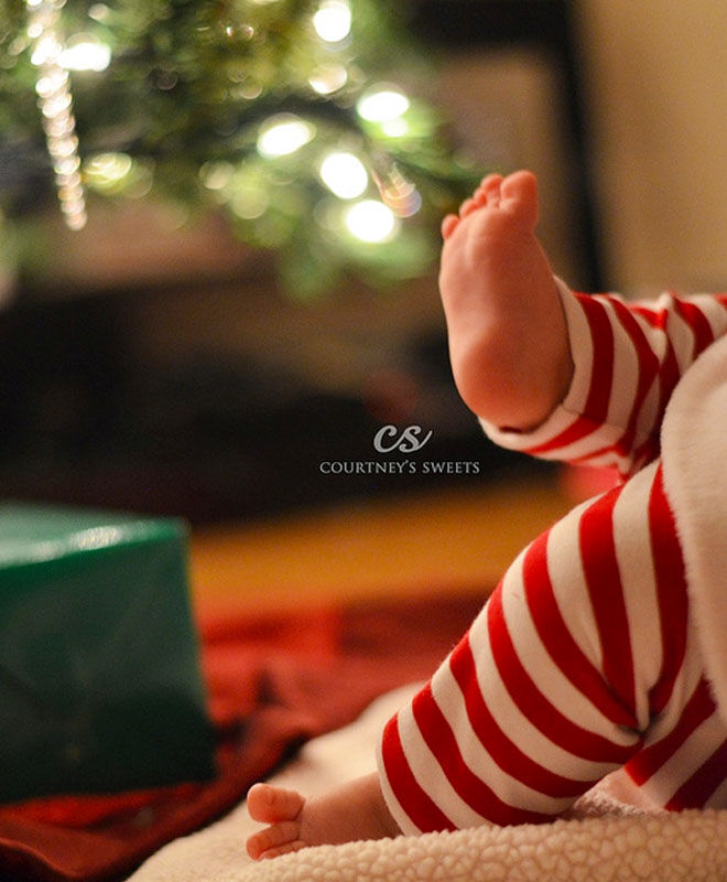 Baby's first Christmas photo ideas - dressed in red and white stockings