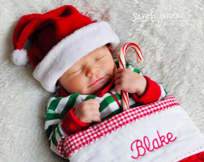 Baby's first Christmas photo, newborn baby in stocking
