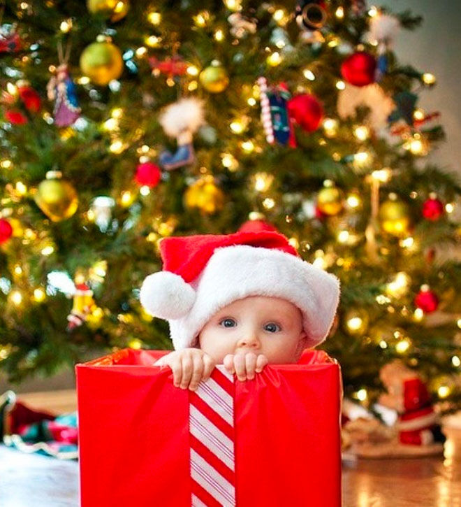 Baby's first Christmas photo, adorable gift in a box