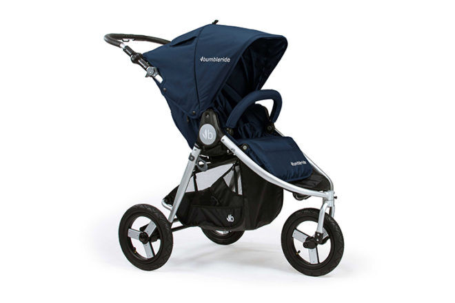 Side angle view of Bumbleride Indie All-terrain stroller in navy, showing canopy, frame, tyres and storage basket.