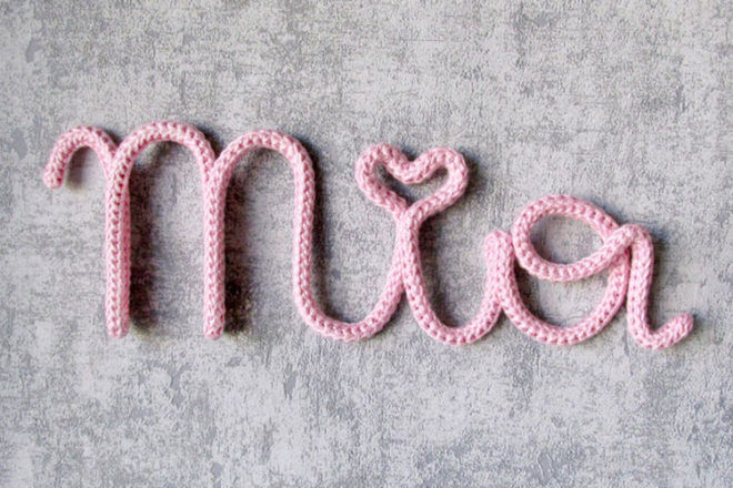 Knitted name signs for nursery walls