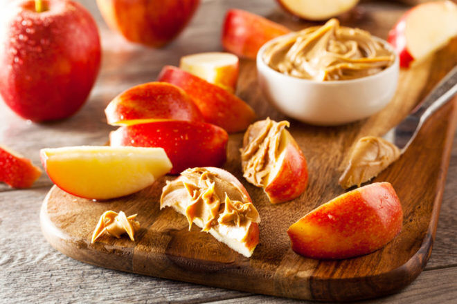 apple slices with almond butter is a quick and healthy post-pregnancy snack