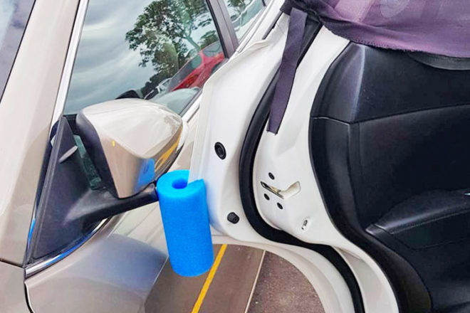 Using a pool noodle as a car door protector