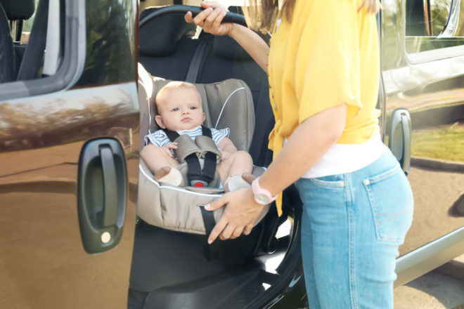 Mums are being warned of the health risks involved when carrying baby car seats