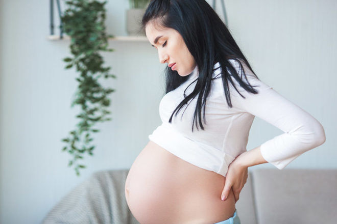 What causes backache during pregnancy?