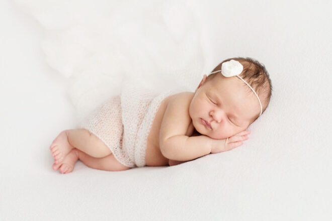 Portrait of newborn baby sleeping on a blanket