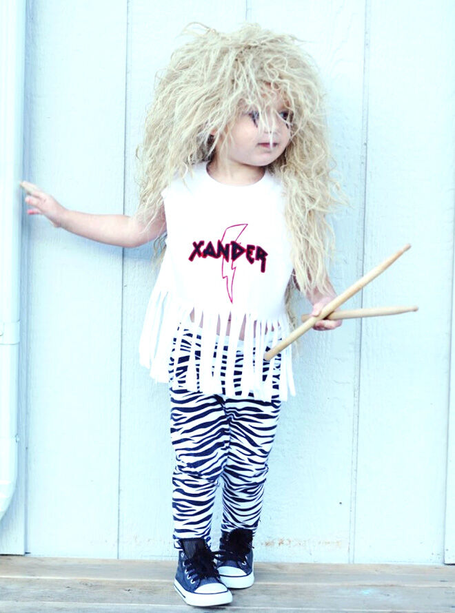 a toddler girl wearing an 80s rocker costume for Halloween