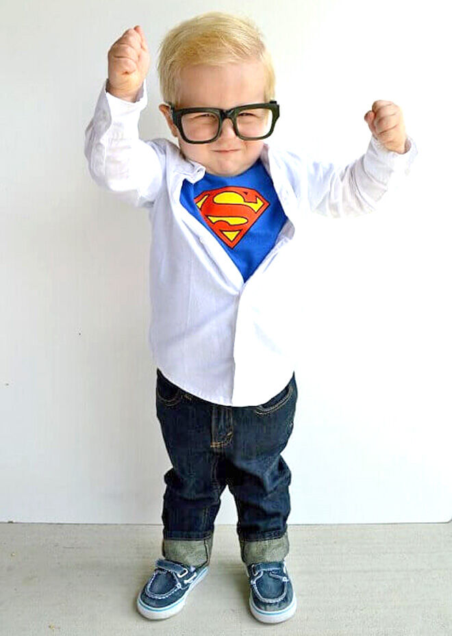 Young toddler wearing a Superman costume