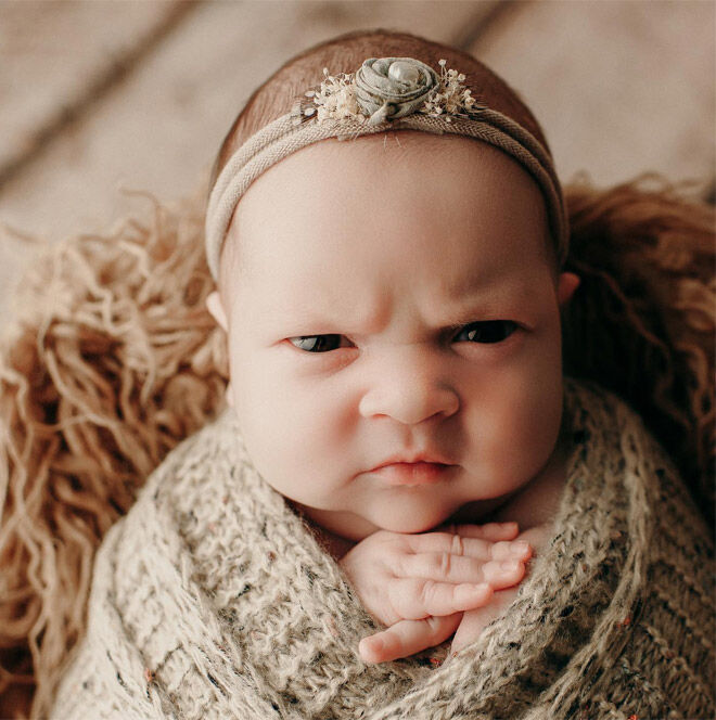 Adorable mean mug baby photo shoot