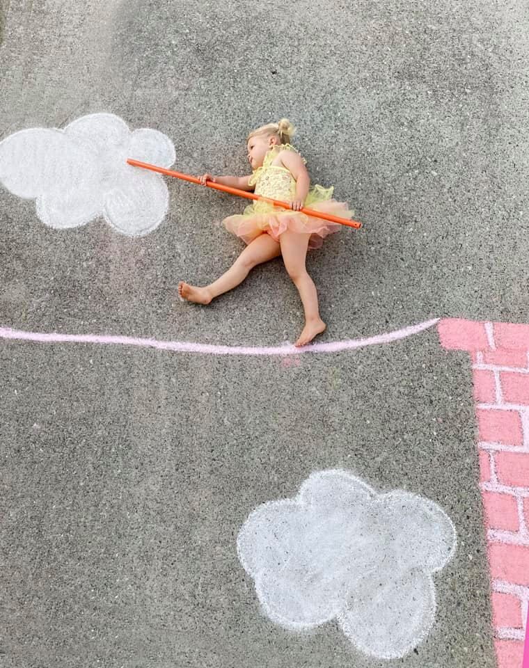 Abbey Burns Tucker side walk chalk art tightrope