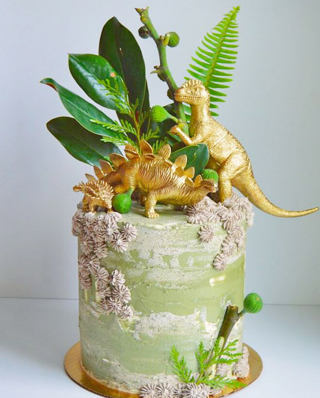 Gold and green dinosaur birthday cake