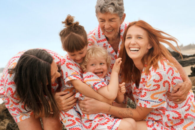 Family wearing matching candy cane christmas pyjamas