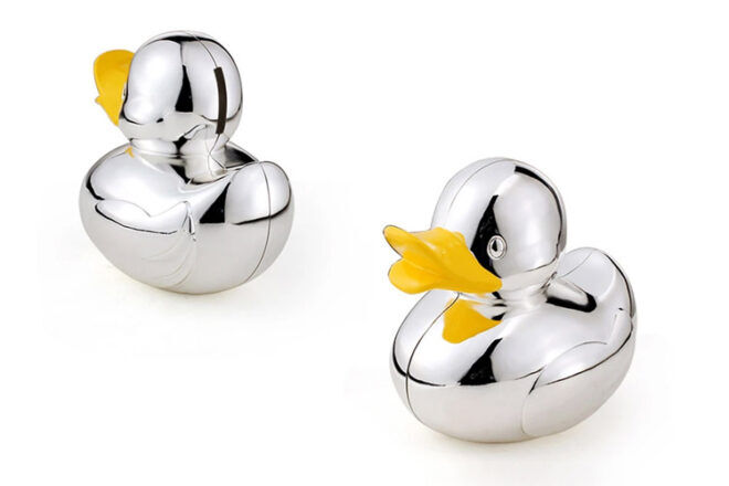 Yellow Octopus showing Silver Rubber Duck Piggy Banks with mirrored exterior and yellow lips
