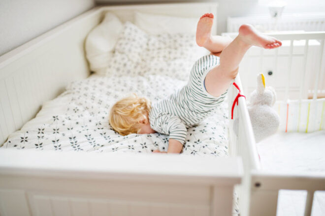 Babyproofing and home safety - Child falling out of cot safety hazard stk