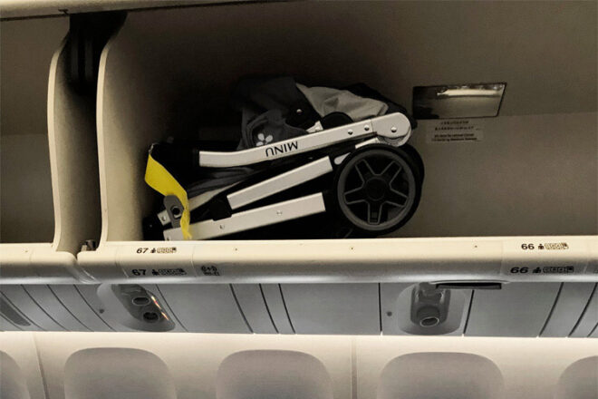 Minu stroller folded in overhead luggage