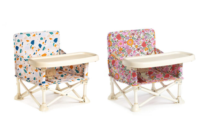 Izimini baby foldout chair showing the front view with the plastic tray attached and its low profile to the ground. 