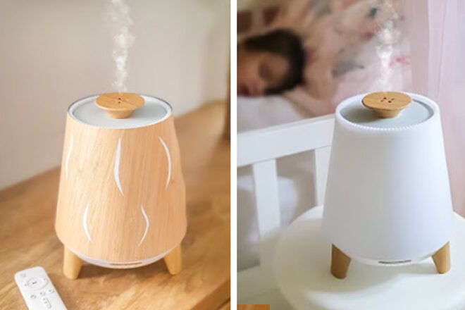 Snotty Noses Hush Baby Humidifier showing the unit with a wooden cover and plain. Steam is rising from both units and they are sitting on a table