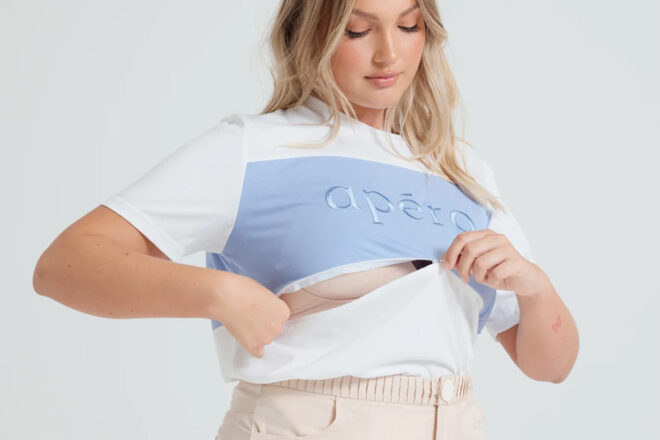 Apero Dual breastfeeding t-shirt showing woman unzipping top to reveal hidden feeding access.